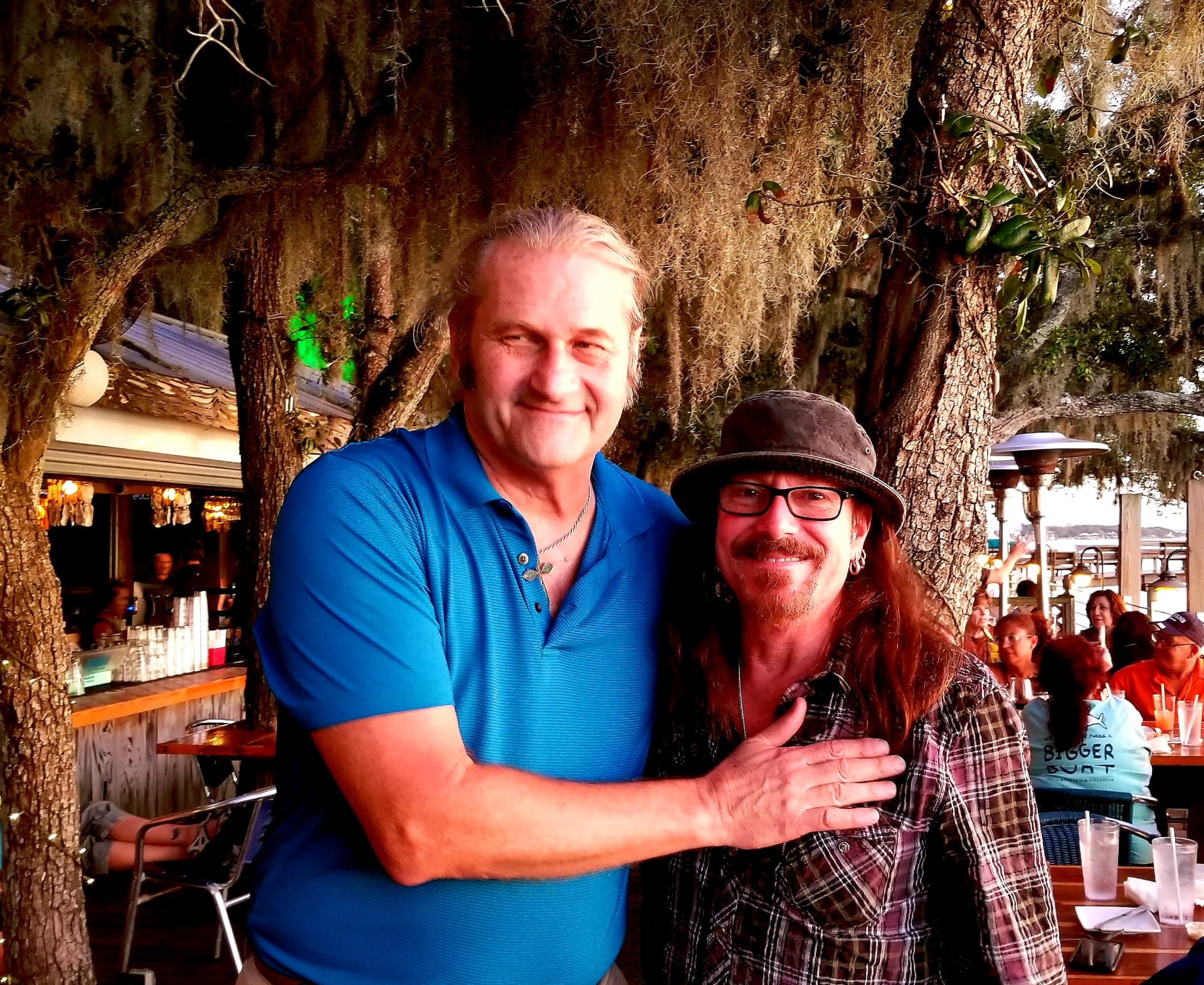 Barry Dunaway with a friend outdoors under Spanish moss